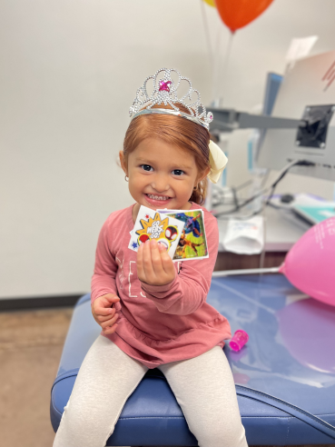 Caring for Dental Crowns Happy Gladstone Patient with Prizes